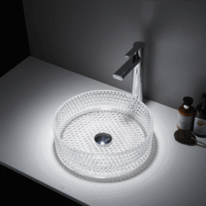 Lavatório de pousar redondo Mumbai em vidro transparente com acabamento mate, instalado sobre tampo